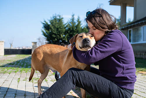 Woman hugging dog